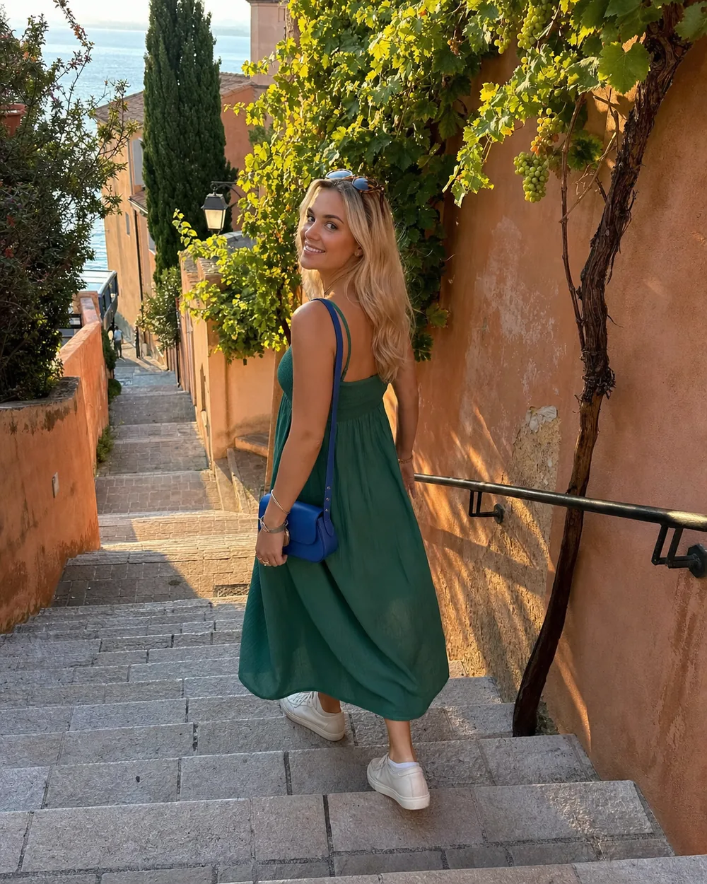 Travel creator turning on old stone steps